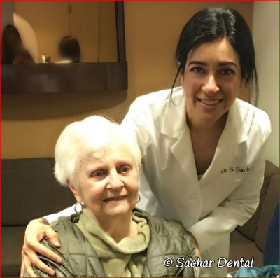Picture of NYC Dentist Dr. Sandip Sachar with a patient