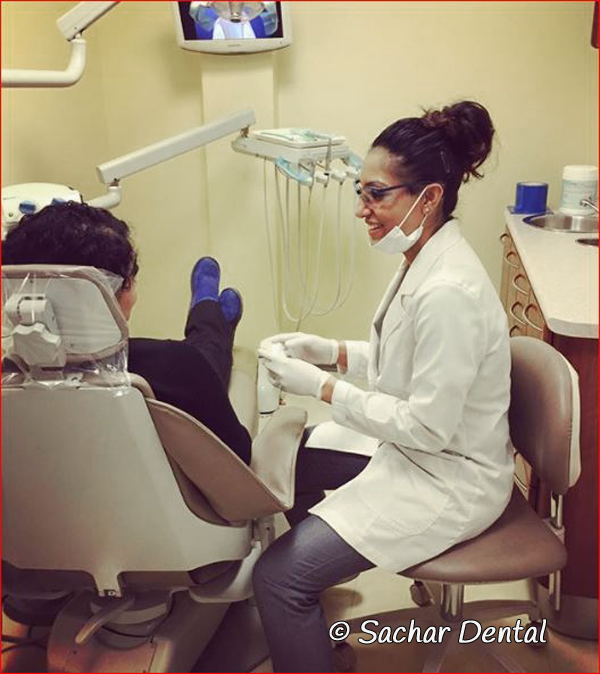 Dentist NYC- hygienist with patient